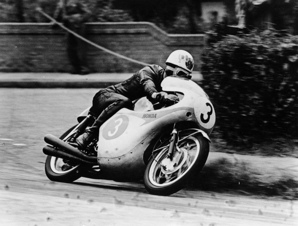 Detail of Bob McIntyre on a Honda, racing in the Isle of Man Junior TT by Anonymous