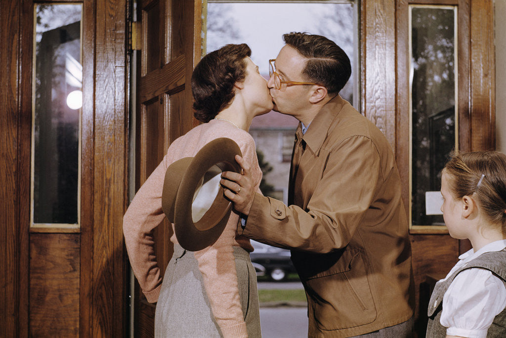 Detail of Husband and Wife Kissing Goodbye by Corbis