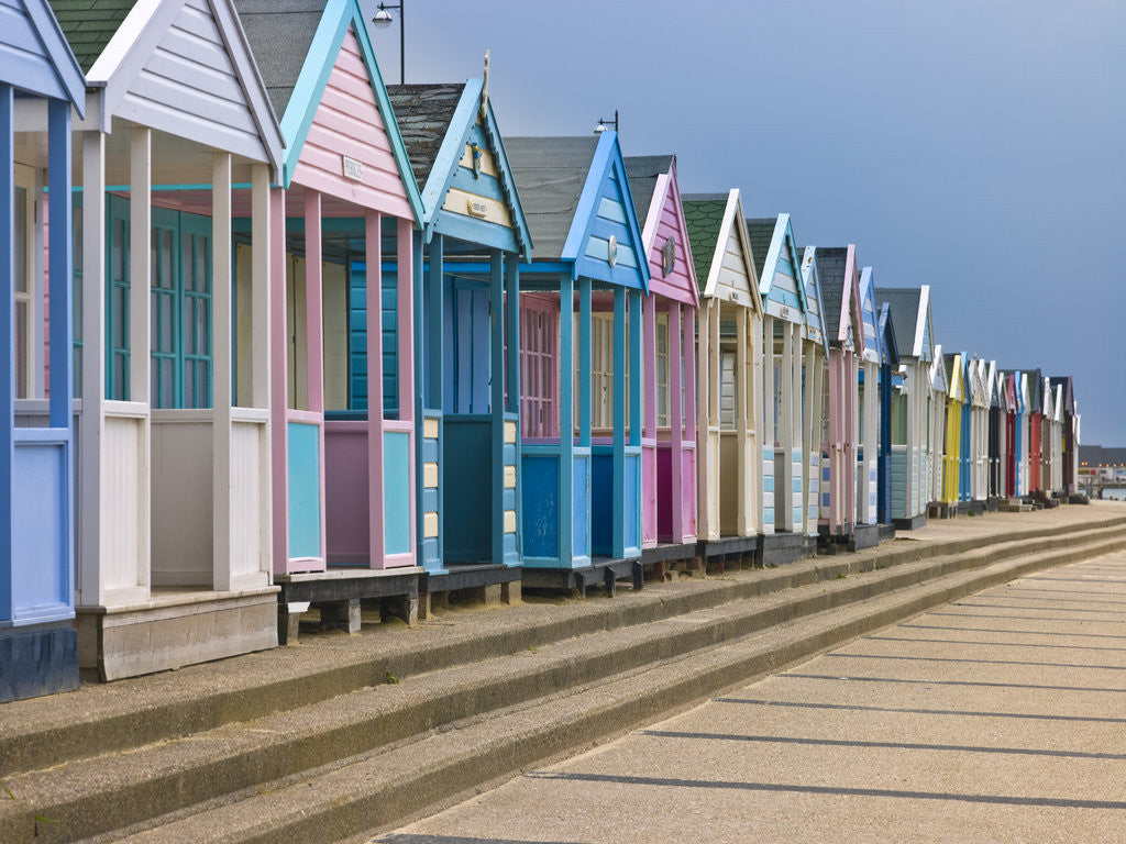 Detail of Multi coloured beach huts in a row by Assaf Frank