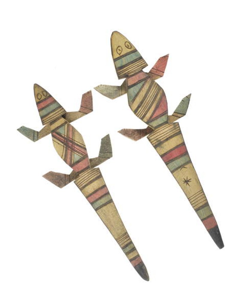 Detail of Carved wooden crocodile figures decorated with red, green and black painted geometric patterns, Hausa People, Kano, Northern Nigeria by Nigerian Nigerian