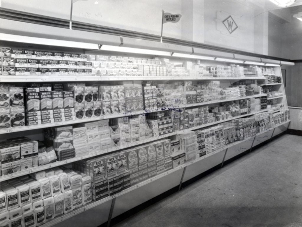 Detail of Cake and pudding mixture aisle, Woolworths store, 1956 by English Photographer