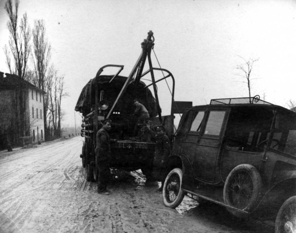 Detail of British soldiers towing a motor vehicle in Italy during WWI by English Photographer