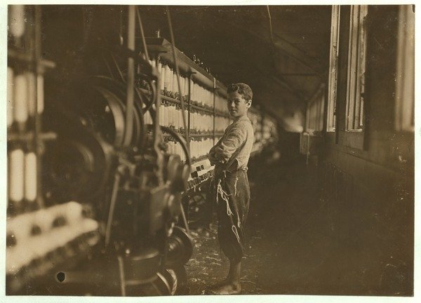 Detail of John Dempsey, 11 or 12 years old, Saturday worker in the mule-spinning room at Jackson Mill, Fiskeville, Rhode Island, 1909 by Lewis Wickes Hine