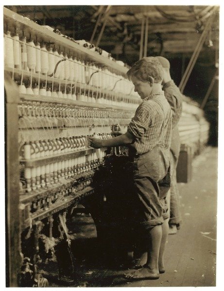 Detail of Young doffers replacing full bobbins at North Pownal, Vermont, 1910 by Lewis Wickes Hine