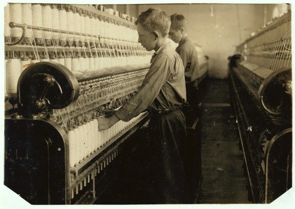 Detail of Doffers replacing full bobbins at Indian Orchard Cotton Mill, Massachusetts, 1916 by Lewis Wickes Hine