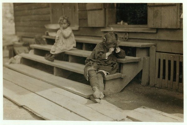 Detail of 5 year old Olga Schubert began work about 5:00 A.M. helping her mother in the Biloxi Canning Factory, Mississippi, picking shrimps by Lewis Wickes Hine