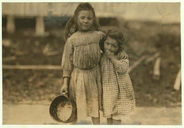 Detail of Maud and Grade Daly, 5 and 3 years old pick about a pot of shrimp each day for the Peerless Oyster Company, Bay St. Louis, Mississippi, 1911 by Lewis Wickes Hine