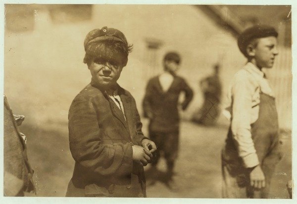 Detail of Joe Mello, aged 8 or 9 works as a mill sweeper in New Bedford, Massachusetts, 1911. by Lewis Wickes Hine