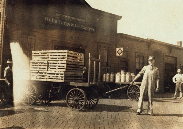 Detail of Men in front of a Wells Fargo & Co Express depot with crates and milk cans, Springfiled, Missouri, 1916 by Lewis Wickes Hine