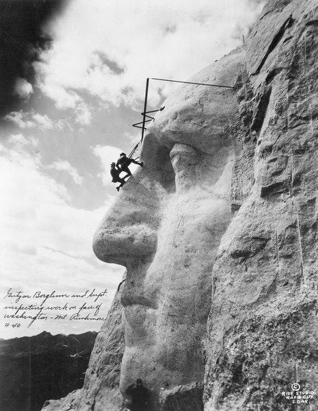 Detail of Gutzon Borglum inspecting work on Washington at Mount Rushmore, 1932 by American Photographer