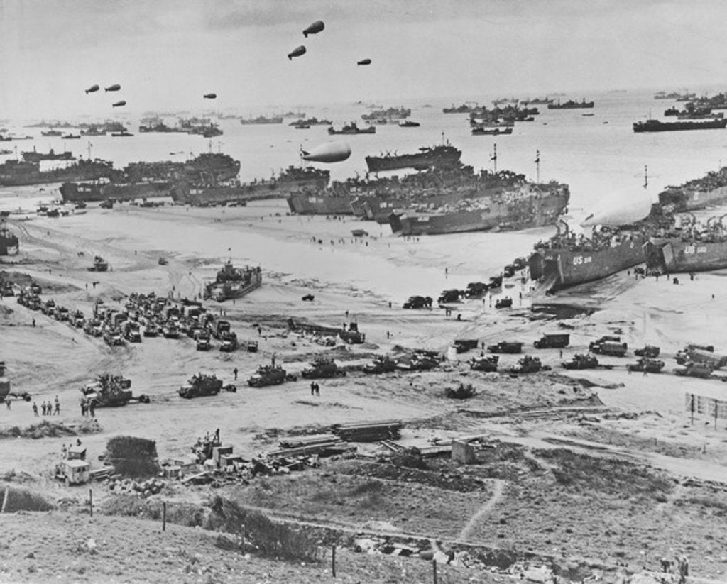 Detail of D Day: view of landing craft, barrage balloons, and allied troops landing in Normandy, 1944 by American Photographer