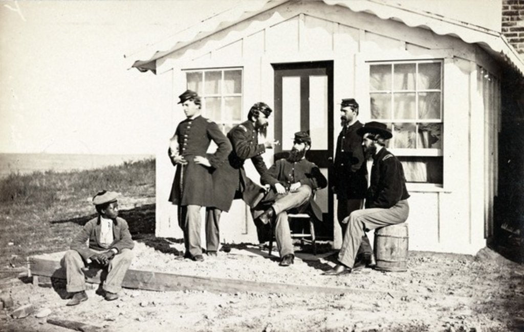 Detail of Five Civil War soldiers gathered on dirt porch outside home, African American youth seated near them, 1861-65 by American Photographer