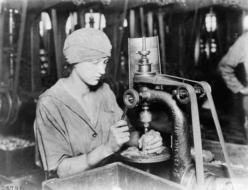 Detail of Woman countersinking detonator tube hole and filling hole in hand grenade at Westinghouse Electric & Mfg. Co., East Pittsburgh, Pa., during World War I, 1914-18 by American Photographer