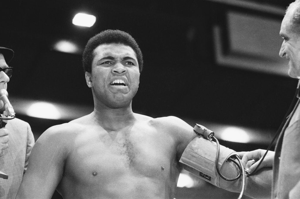 Detail of Muhammad Ali having his blood pressure taken by Monre Fresco