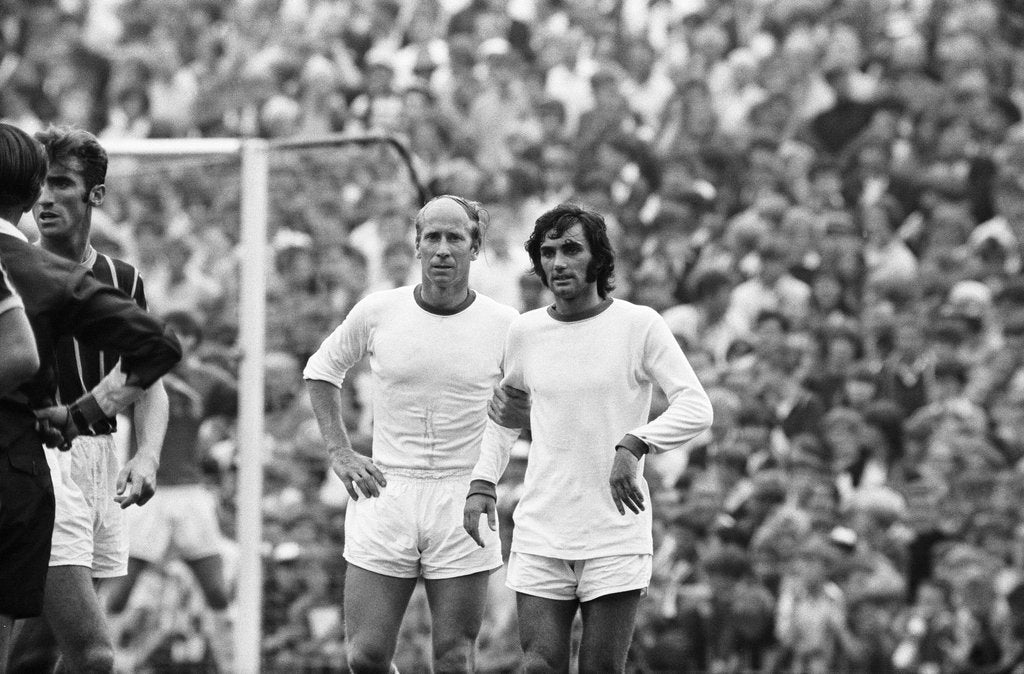 Bobby Charlton and George Best await a free kick 1969 by Monte Fresco