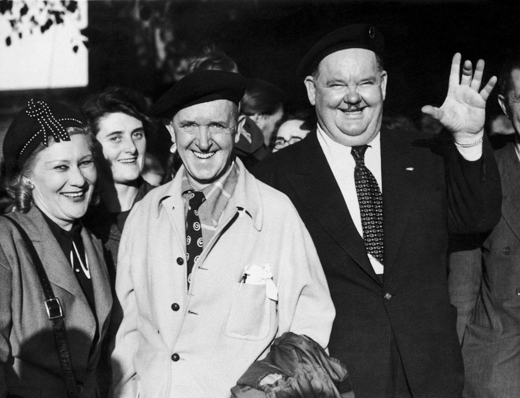 Detail of Stan laurel and Oliver hardy outside Coventry station August 1947. by Staff