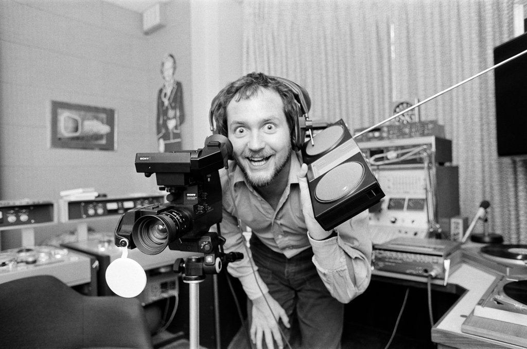 Detail of Kenny Everett in studio at home by Wilkinson