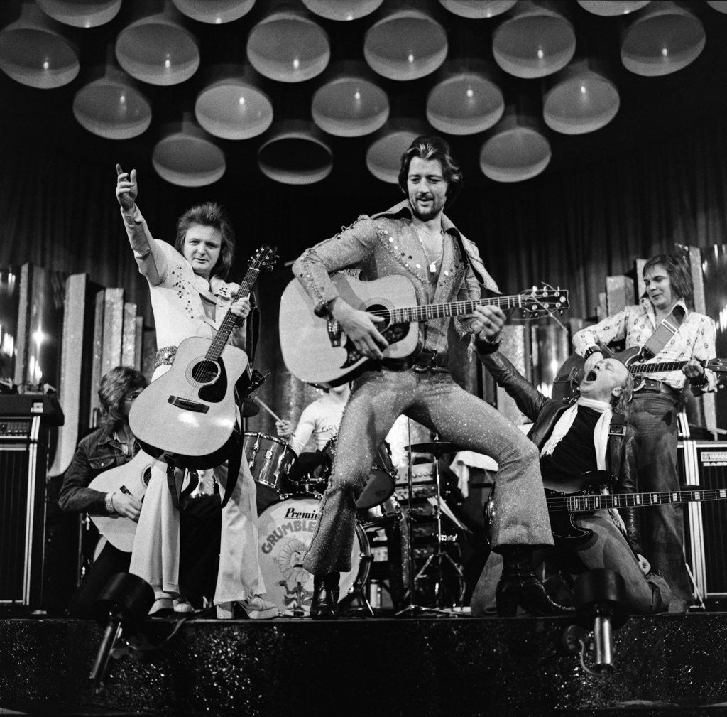 Detail of Frank worthington playing guitar 1975 by Dick Williams
