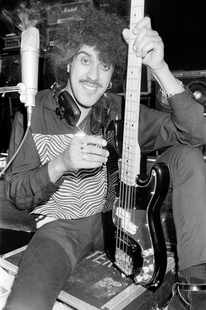 Detail of Phil Lynott of Thin Lizzy during a recording session for the groups new album. by Andy Hosie