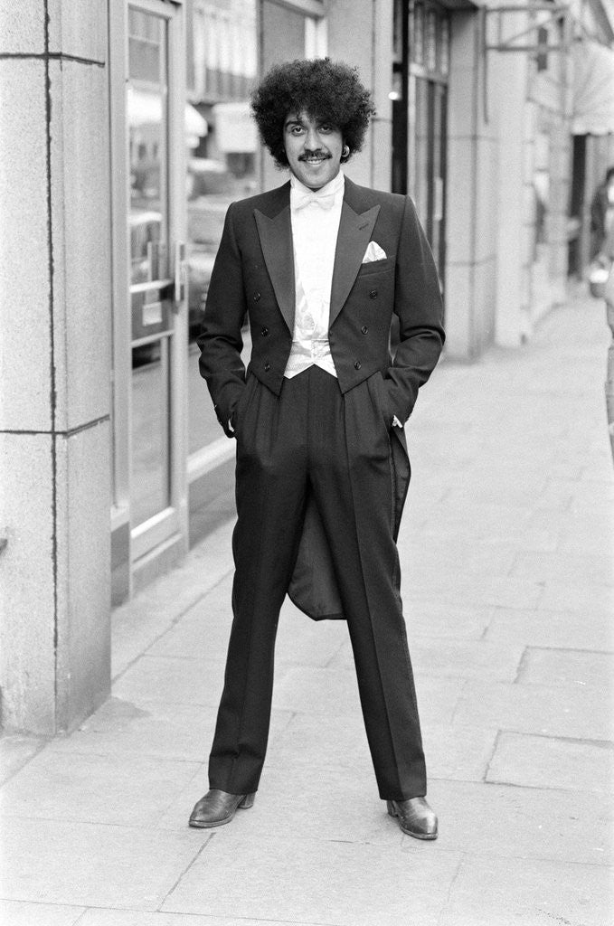 Detail of Phil Lynott in London, modelling clothes from Saville Row. 1983 by Mike Maloney