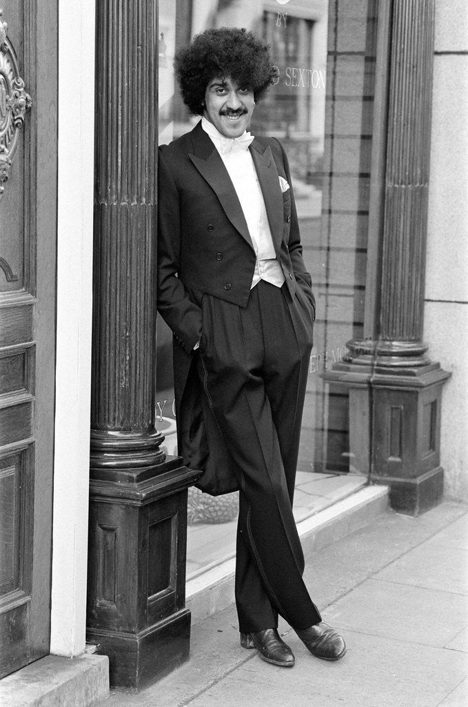 Detail of Phil Lynott in London, modelling clothes from Saville Row. 1983 by Mike Maloney