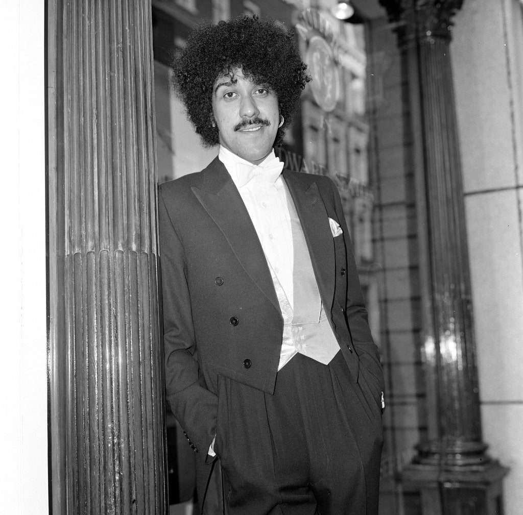 Detail of Phil Lynott in London, modelling clothes from Saville Row. 1983 by Mike Maloney