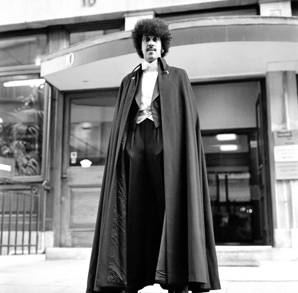 Detail of Phil Lynott in London, modelling clothes from Saville Row. 1983 by Mike Maloney