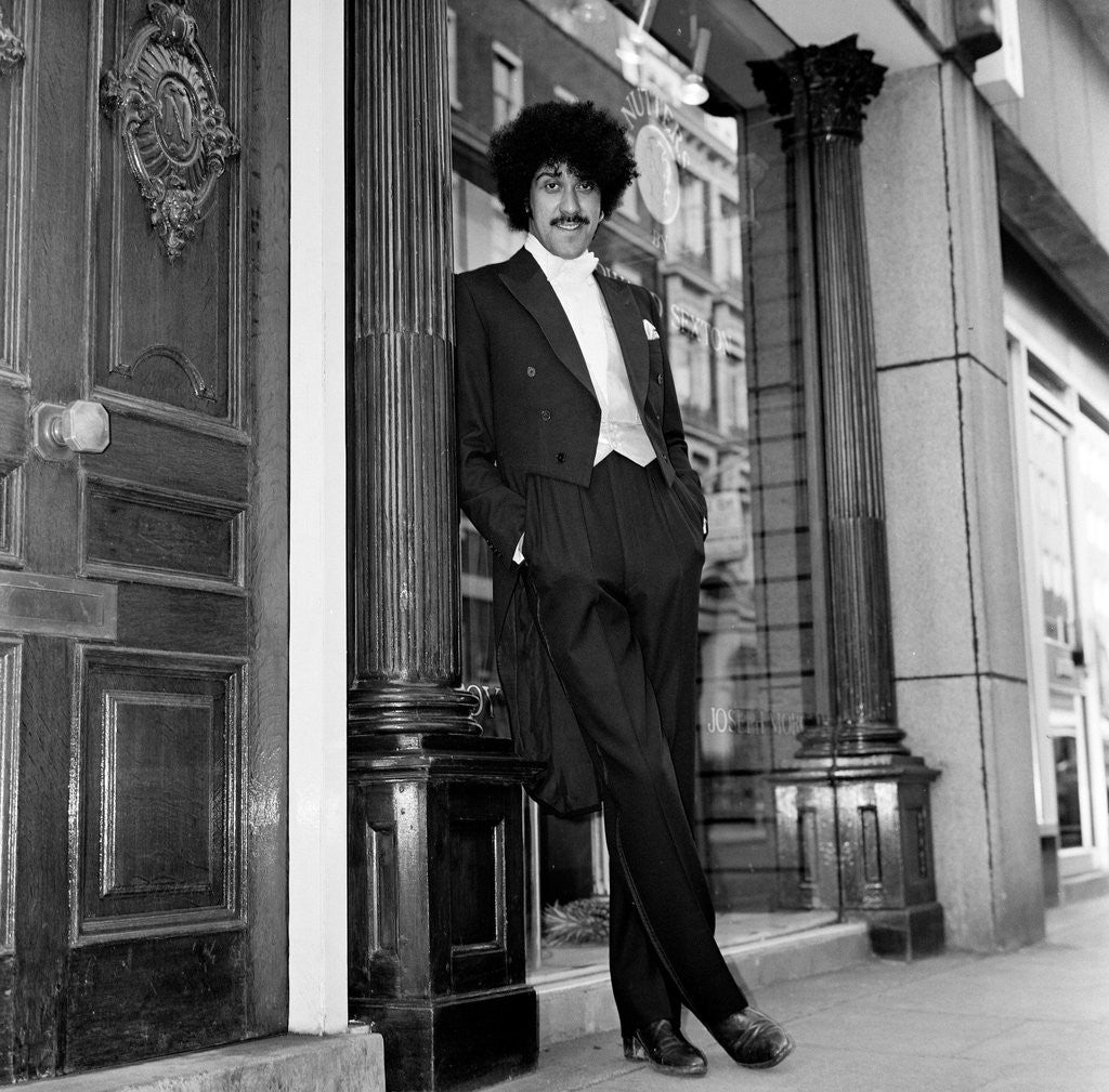 Detail of Phil Lynott in London, modelling clothes from Saville Row. 1983 by Mike Maloney