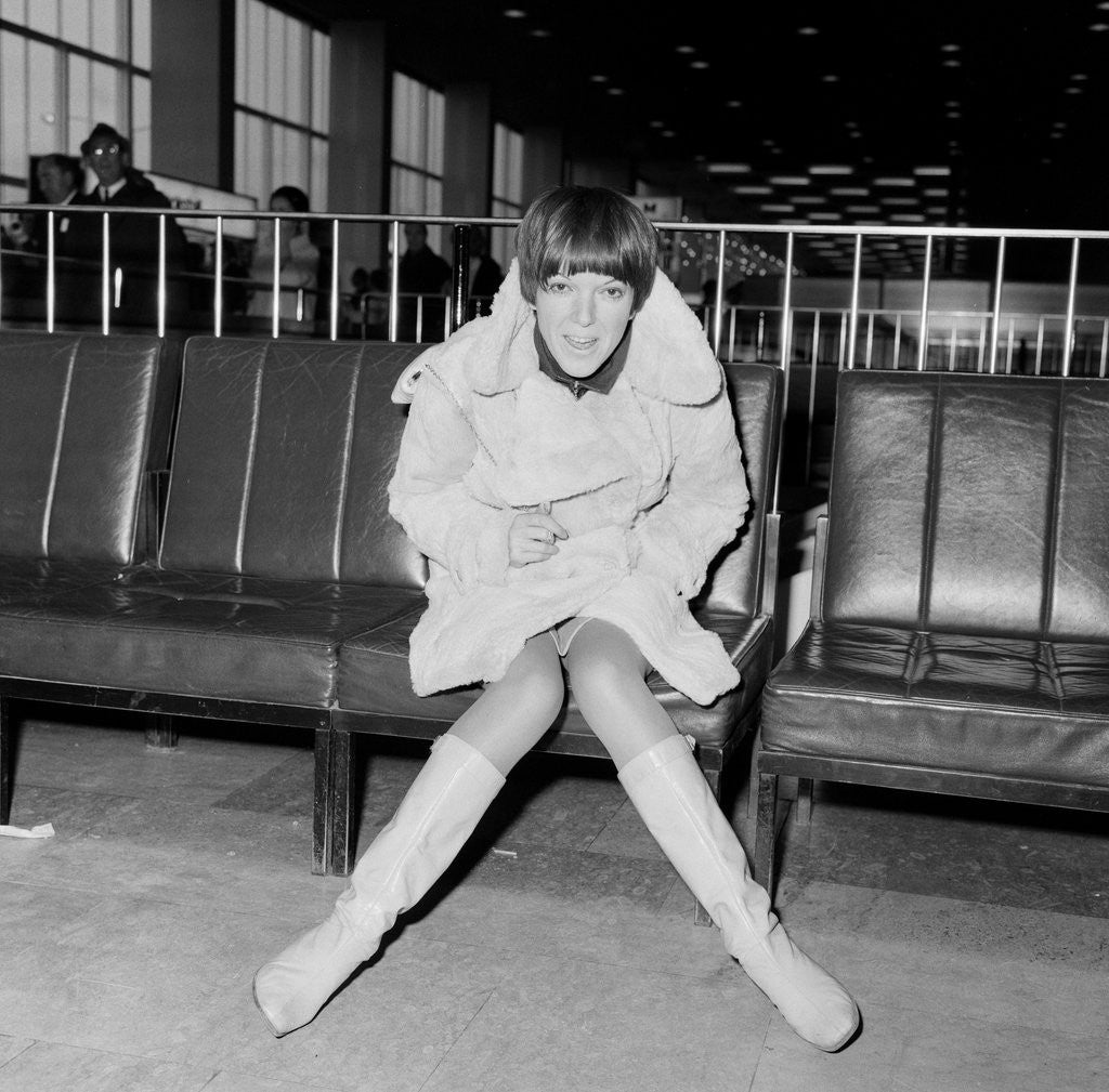 Detail of Mary Quant, at London Airport, on her way to Paris to go to a fancy dress ball. by Staff