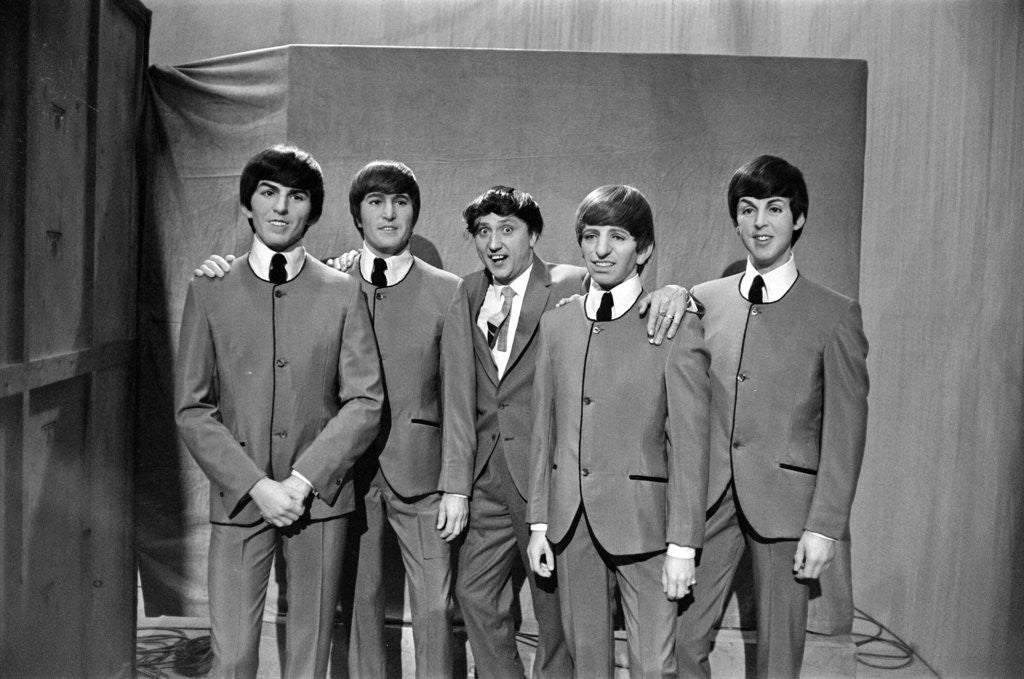 Detail of Ken Dodd (centre) posing with Madame Tussauds figures of The Beatles. Picture taken on the set of Juke Box Jury, that Ken Dodd is filming. by Staff