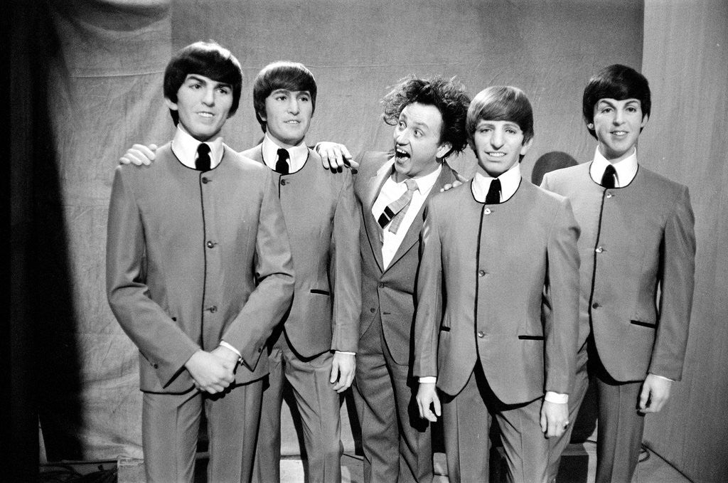 Detail of Ken Dodd (centre) posing with Madame Tussauds figures of The Beatles. Picture taken on the set of Juke Box Jury, that Ken Dodd is filming. by Staff