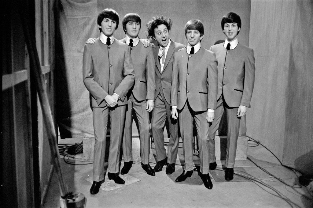Detail of Ken Dodd posing with Madame Tussauds figures of The Beatles by Unknown