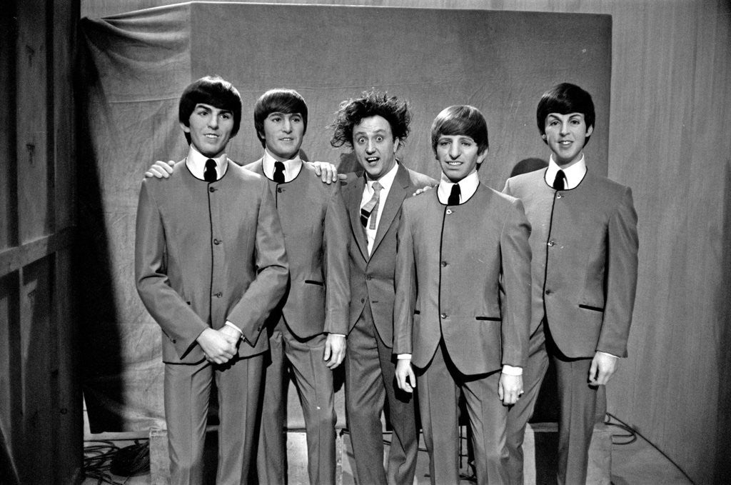 Detail of Ken Dodd posing with Madame Tussauds figures of The Beatles by Unknown