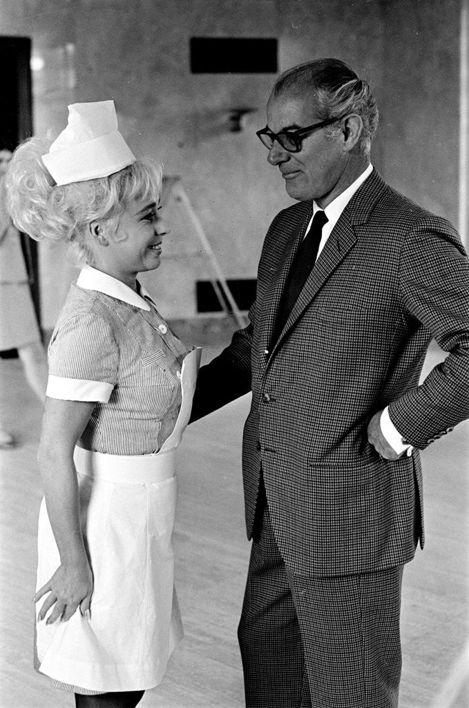 Detail of Barbara Windsor and producer Peter Rogers on the film set of Carry On Doctor. by Staff