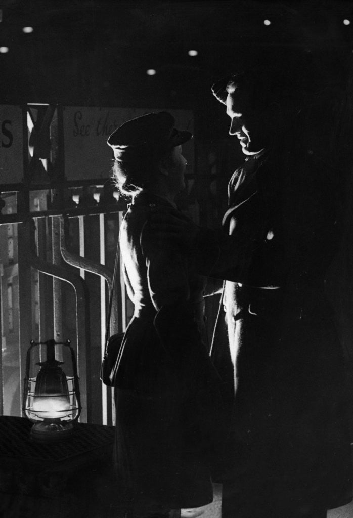 Detail of A young wartime couple say their goodbyes at the station as he returns to his army unit. 20th February 1944 by Staff