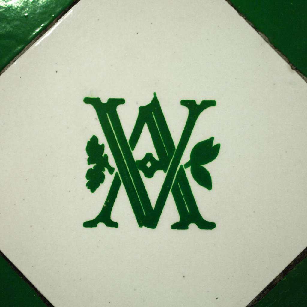 Detail of V&A logo on an interior wall of the Royal Toilets in the V&A Museum by Stuart Cox