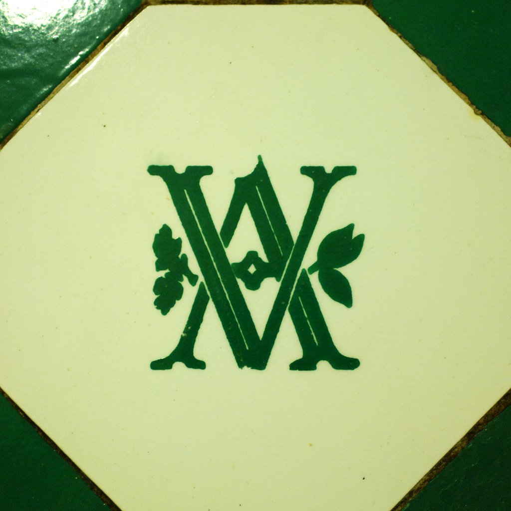 Detail of V&A logo on an interior wall of the Royal Toilets in the V&A Museum by Stuart Cox