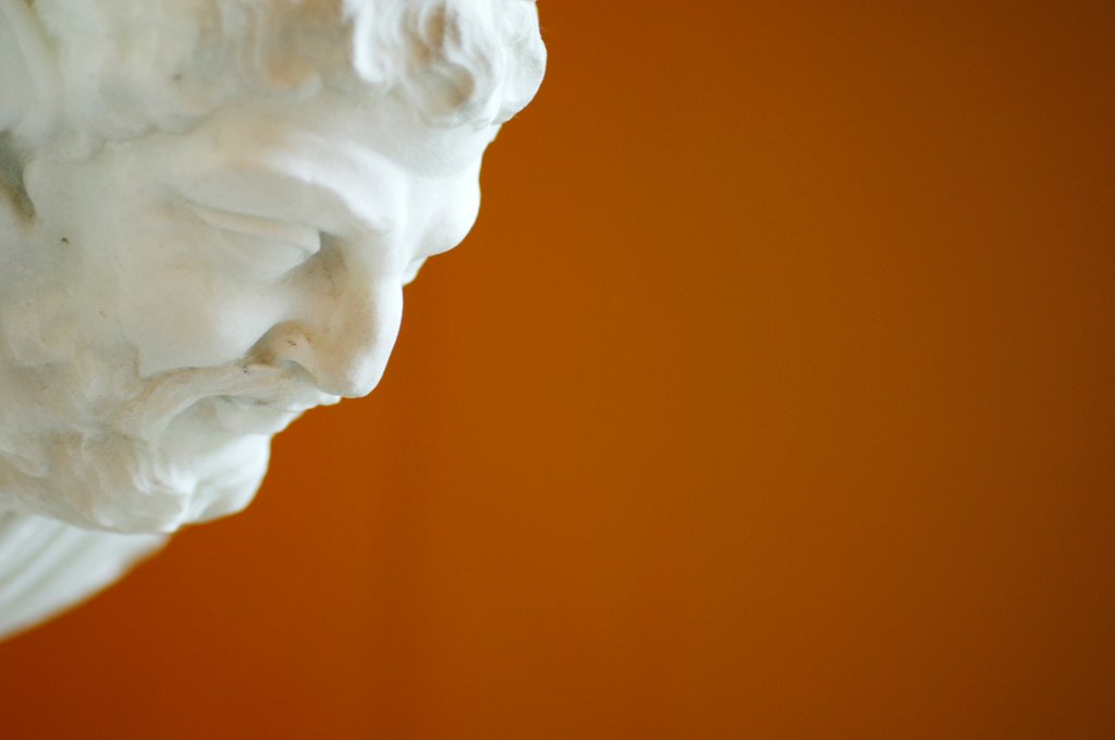Detail of A head of a man staring down by Stuart Cox