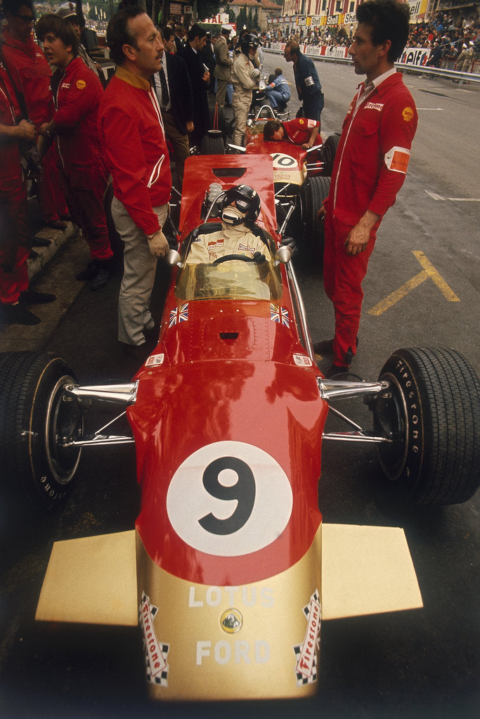 Detail of Colin Chapman and a mechanic in discussion over Graham Hill's Lotus, Monaco Grand Prix, 1969 by Unknown