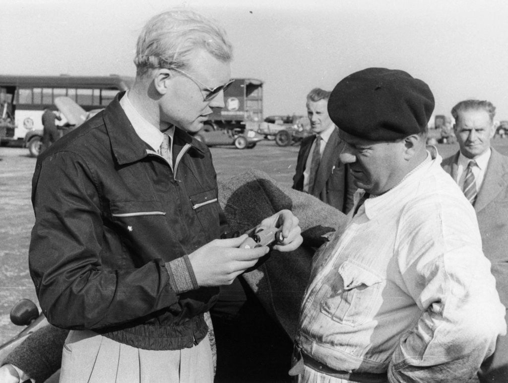 Detail of Mike Hawthorn with a model car by Anonymous