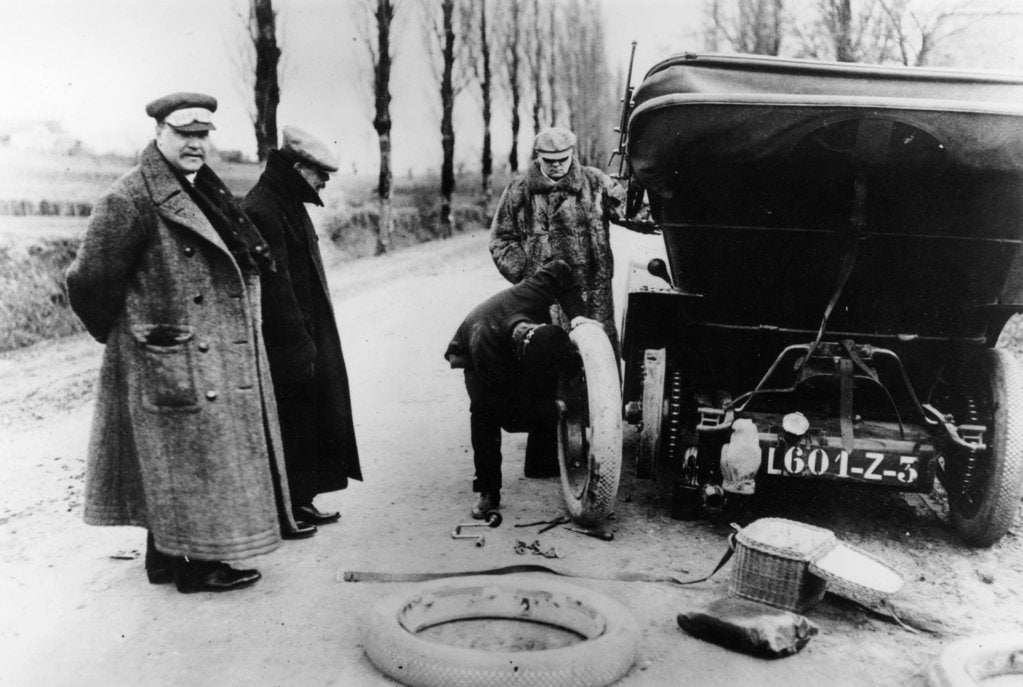 Detail of Lord Northcliffe's chauffeur changing a tyre, (c1908?) by Unknown