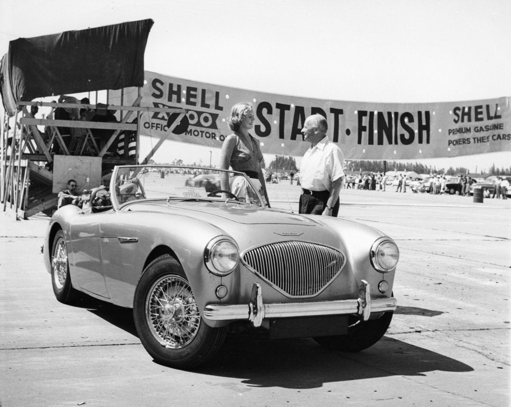 Detail of Donald Healey with an Austin Healey at a motor race by Unknown