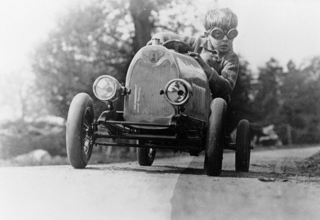 Detail of Boy in a pedal car by Unknown