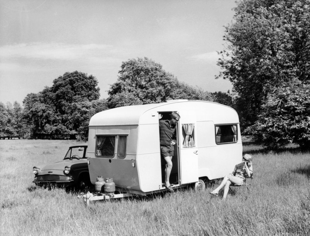 Detail of Couple on holiday with their 1963 Sprite Alpine caravan, (c1963?) by Unknown
