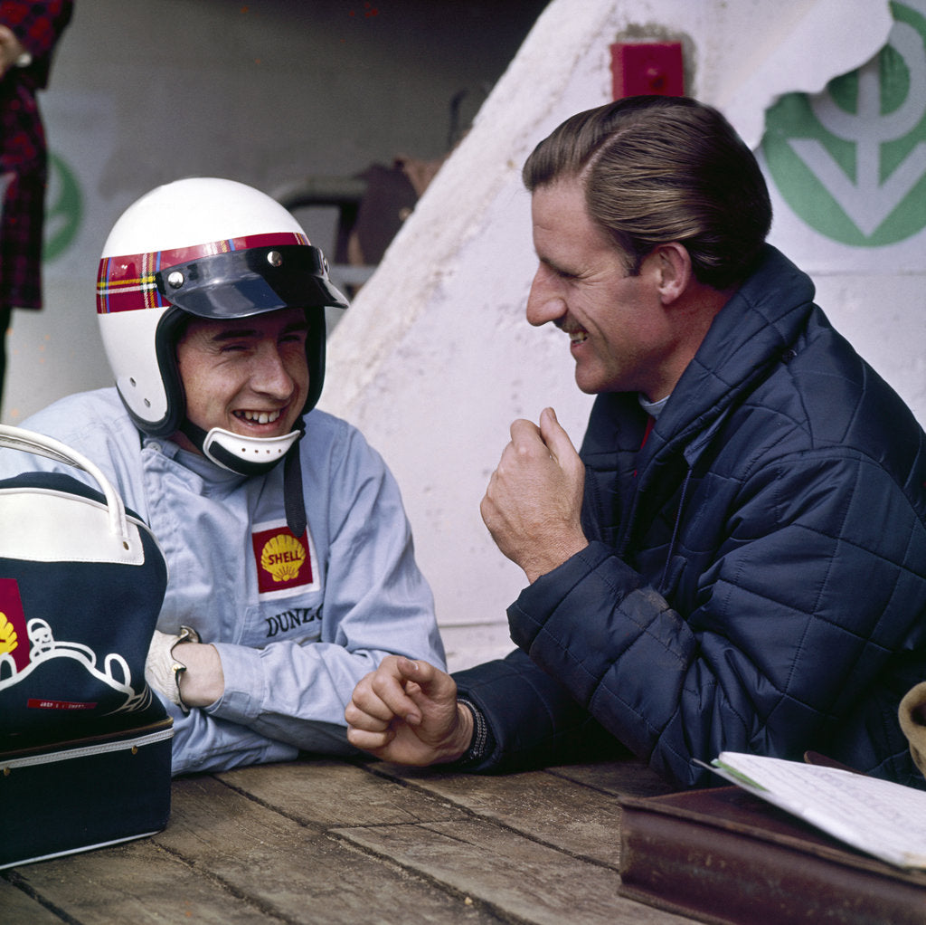 Detail of Jackie Stewart and Graham Hill chatting, Monaco Grand Prix, Monte Carlo, 1966 by Unknown