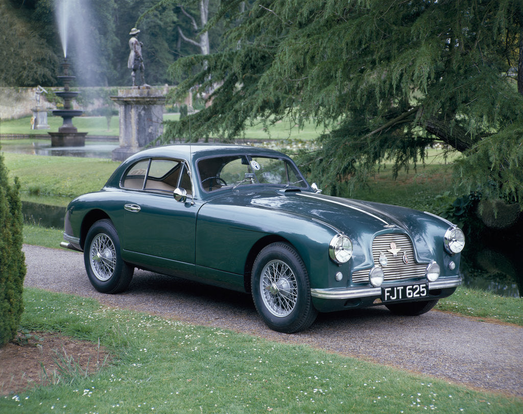 Detail of A 1952 Aston Martin DB2 saloon car photographed in a stately garden by Unknown