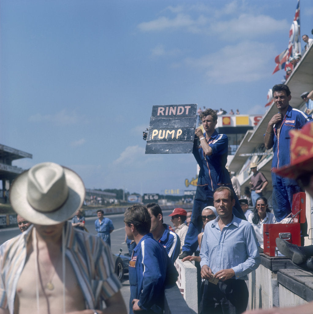 Detail of A mechanic holding up a sign, French Grand Prix, Le Mans, France, 1967 by Unknown