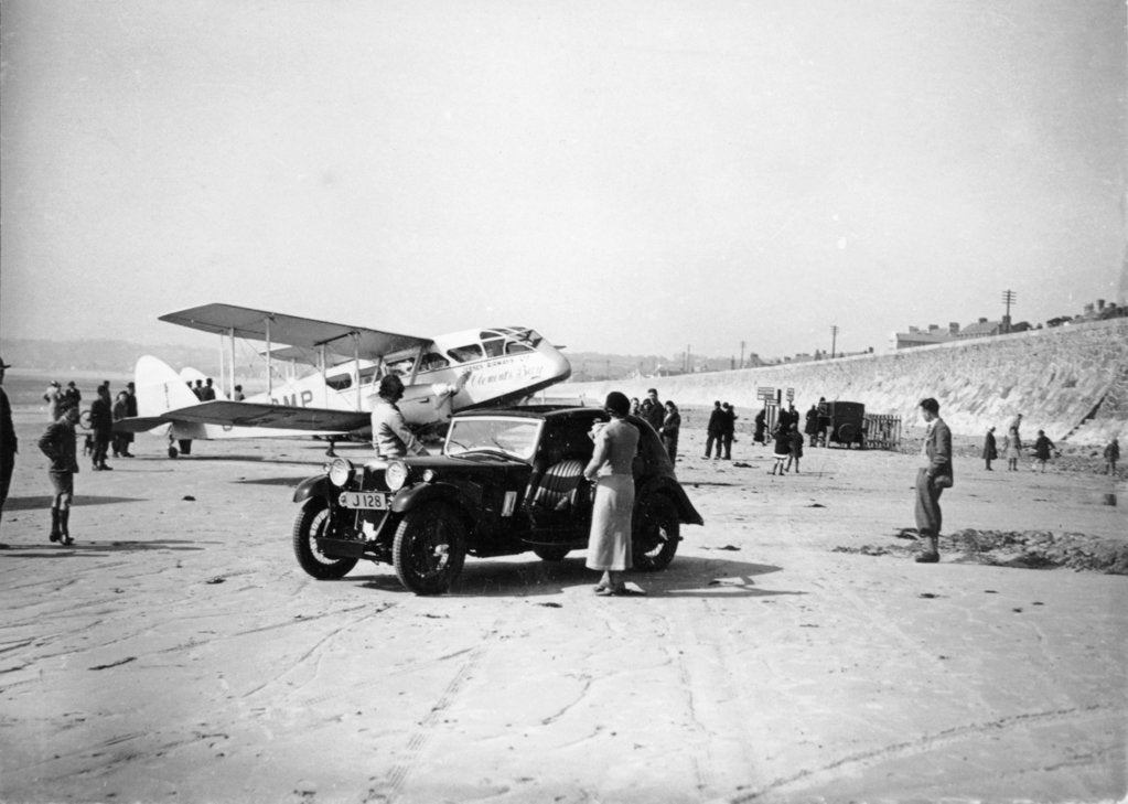 Detail of Riley Kestrel and a Dragon aircraft on a beach, 1934 by Unknown