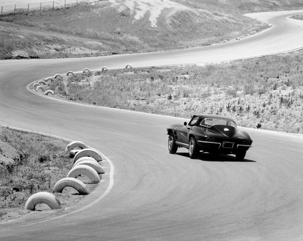 Detail of 1964 Chevrolet Corvette Stingray on a winding racetrack, (c1964?) by Unknown