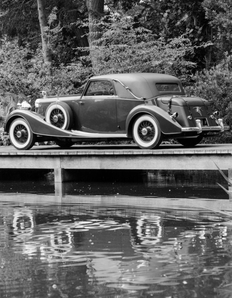 Detail of A 1933 Hispano-Suiza K6 reflected in a lake by Unknown